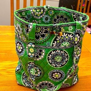 Green Vera bradley tote. Small discoloration on interior pocket. Toggle closure